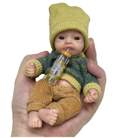 Mini håndflatenyfødt baby dukke